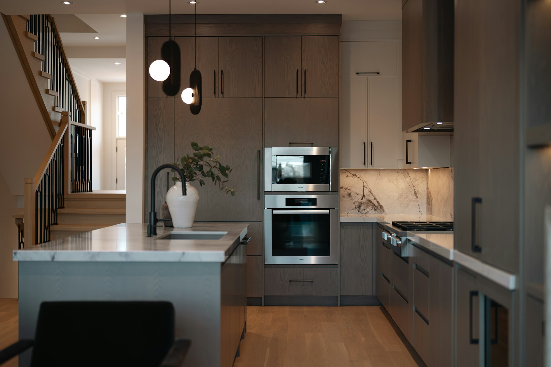 Modern renovated kitchen with a large island and custom cabinetry